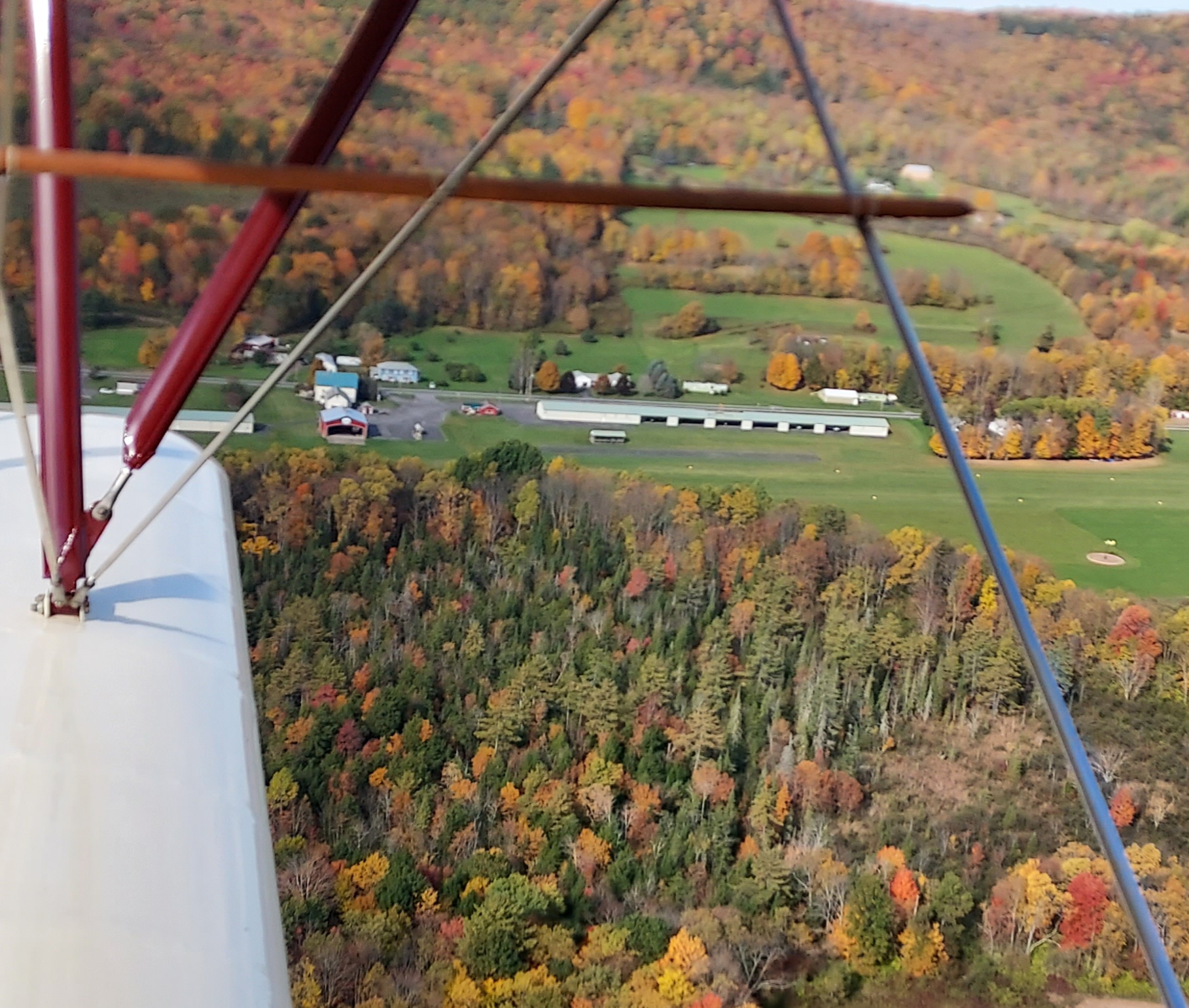 Aerial view of the airport from biplane in fall colors